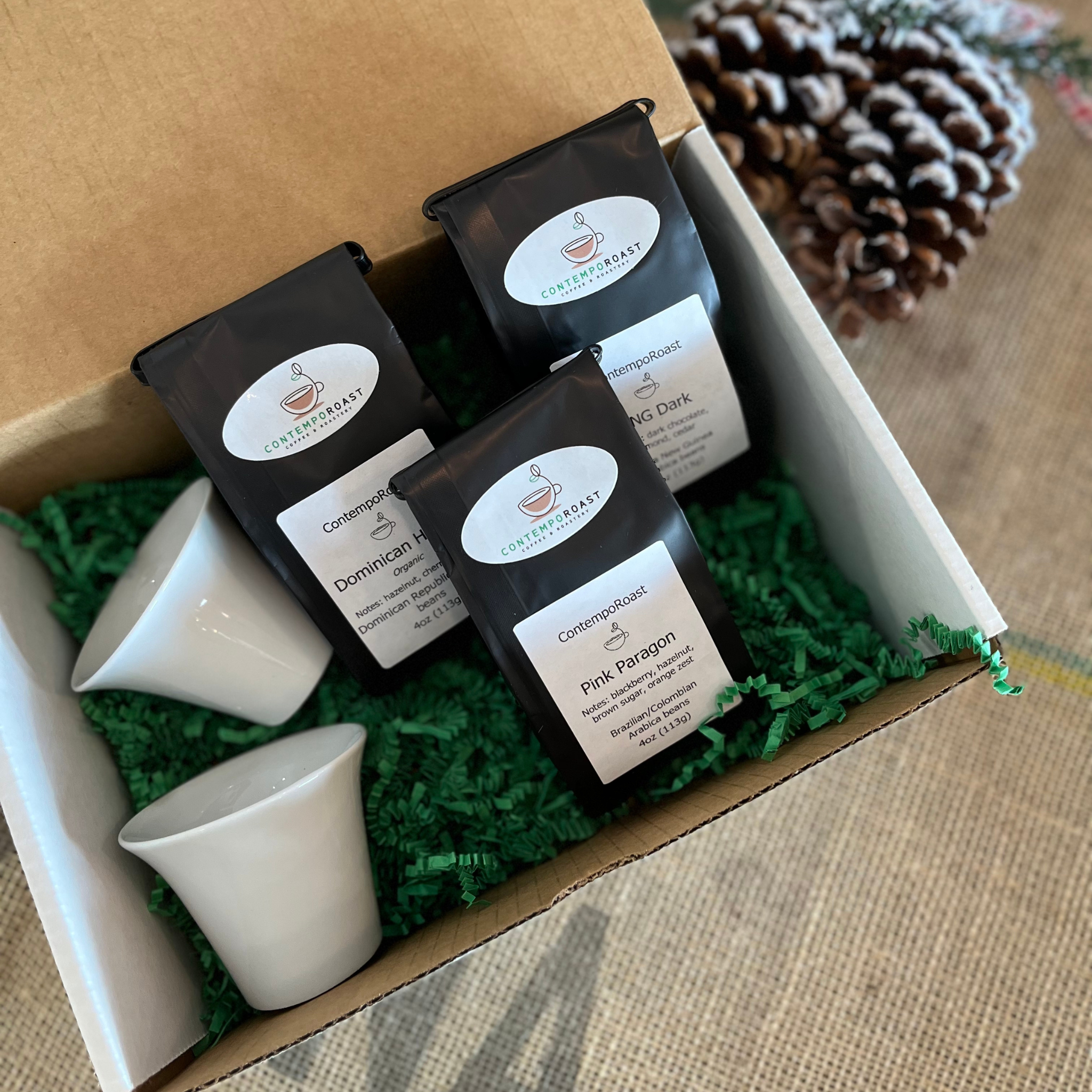two 3oz porcelain notNeutral Cala tasting cups with the Classical set of three 4oz bags of coffee in a gift box