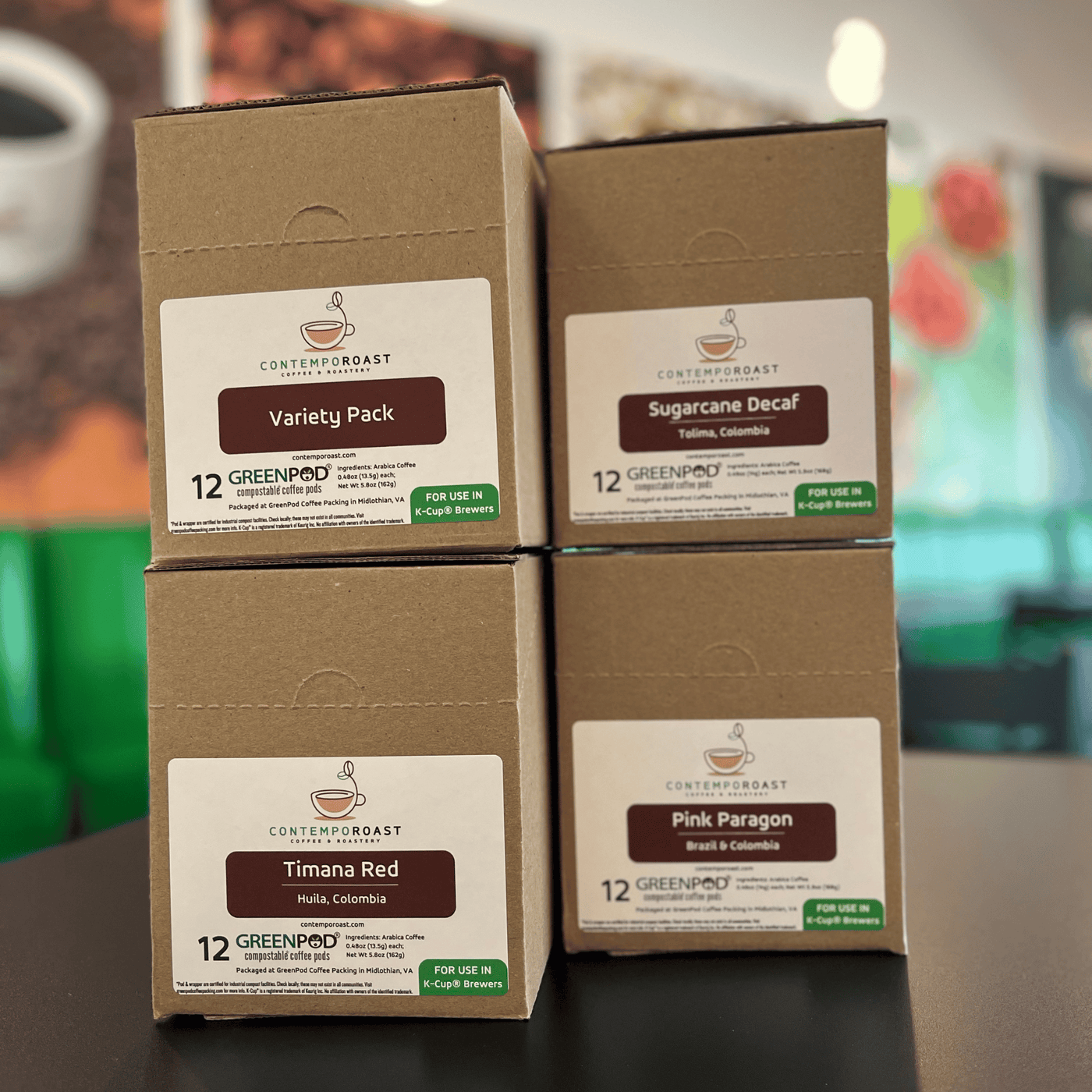 boxes with  labels showing Variety Pack, Sugarcane Decaf, Timana Red and Pink Paragon